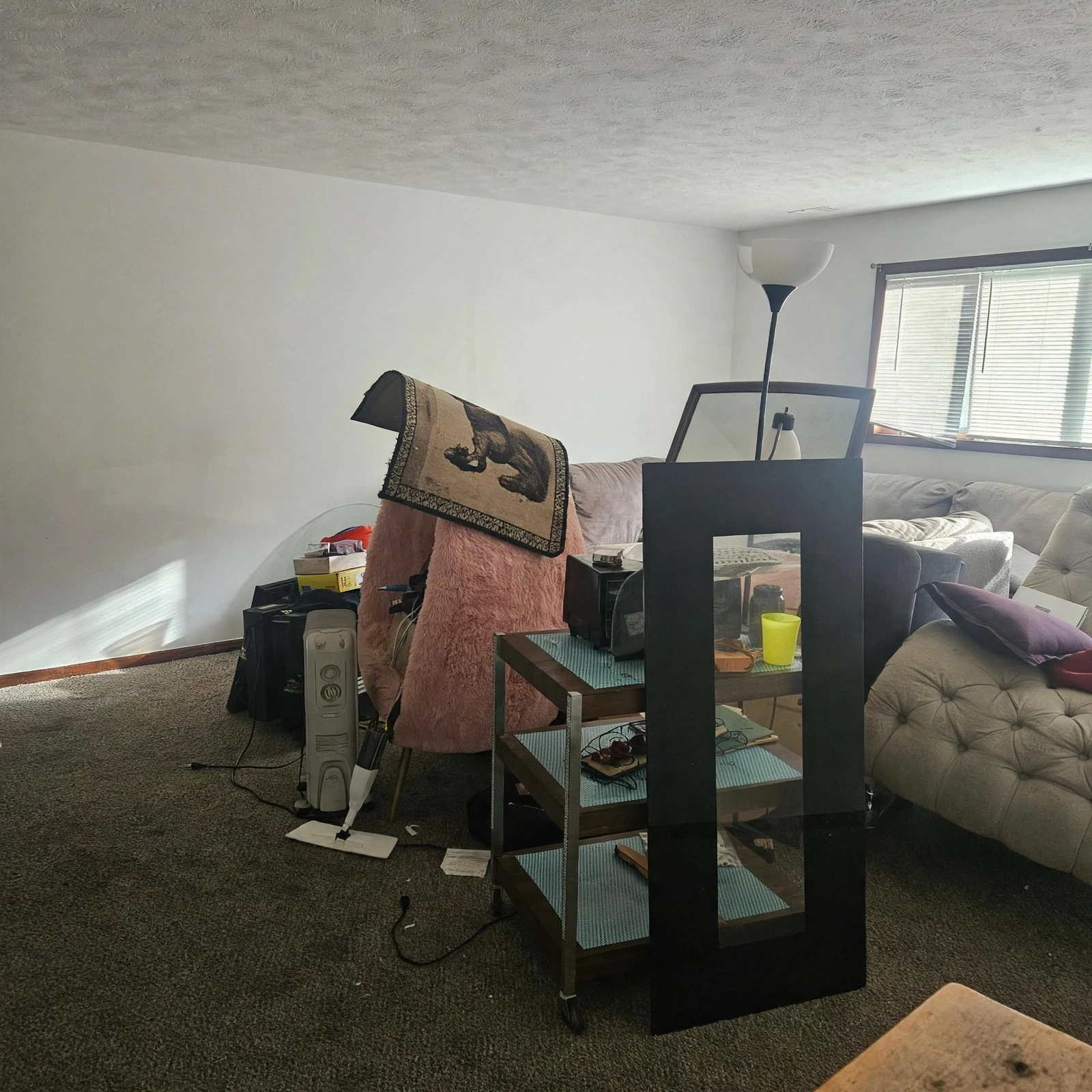 Living room full of old furniture ready for a clear-out in Deira
