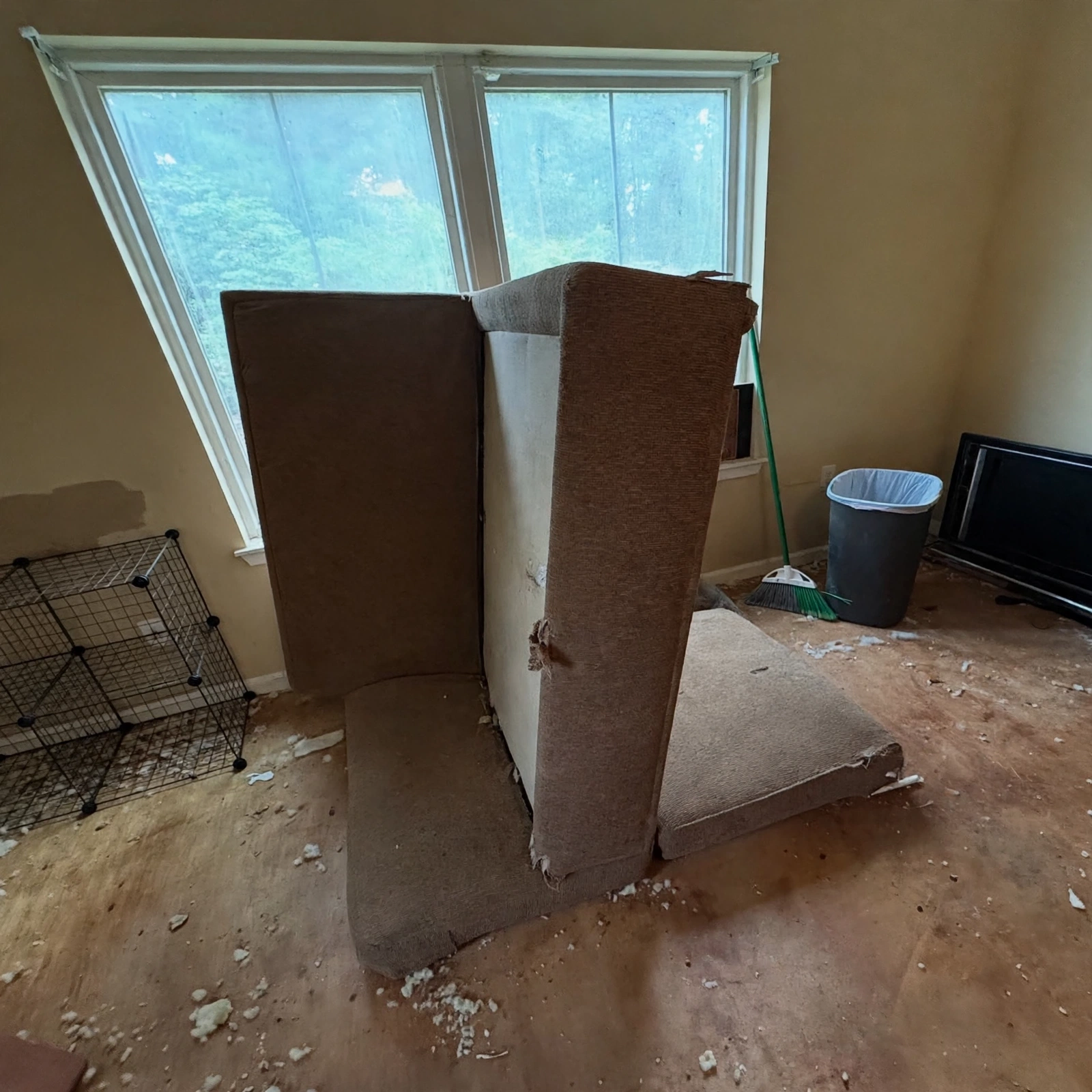 Worn-out sofa standing in an emptied Al Barsha flat ready for junk removal